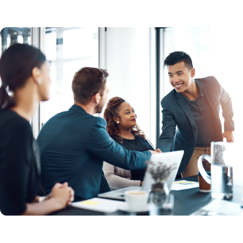 Two men happily shaking hands in a board room illustrating Hoonify's partnership with companies that drives high-performance computing solutions seamlessly. 